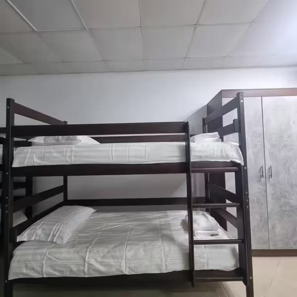 Cozy bedroom with natural light at Aurinia XO Hostel